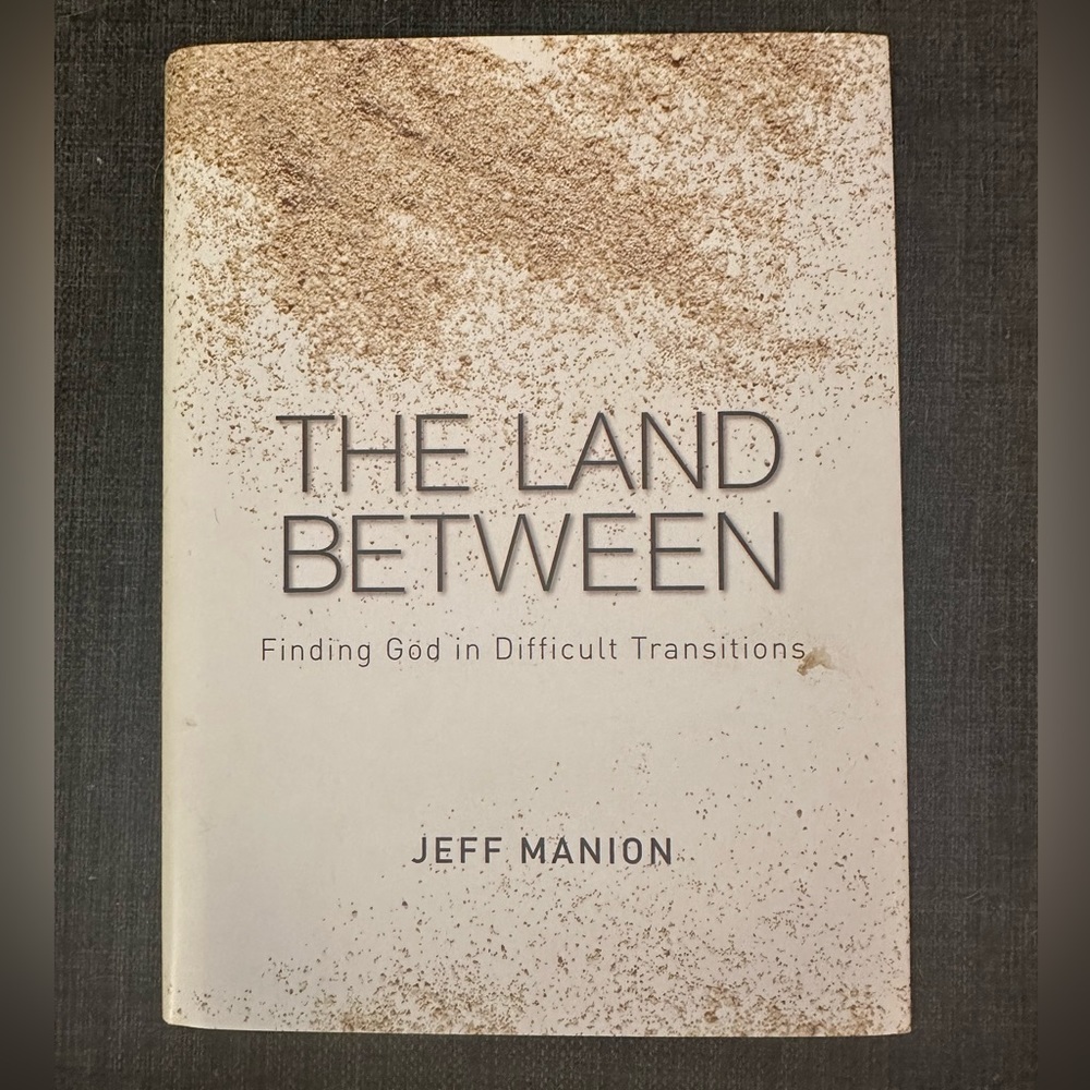 Religious Book “The Land Between” by Jeff Manion. Like New